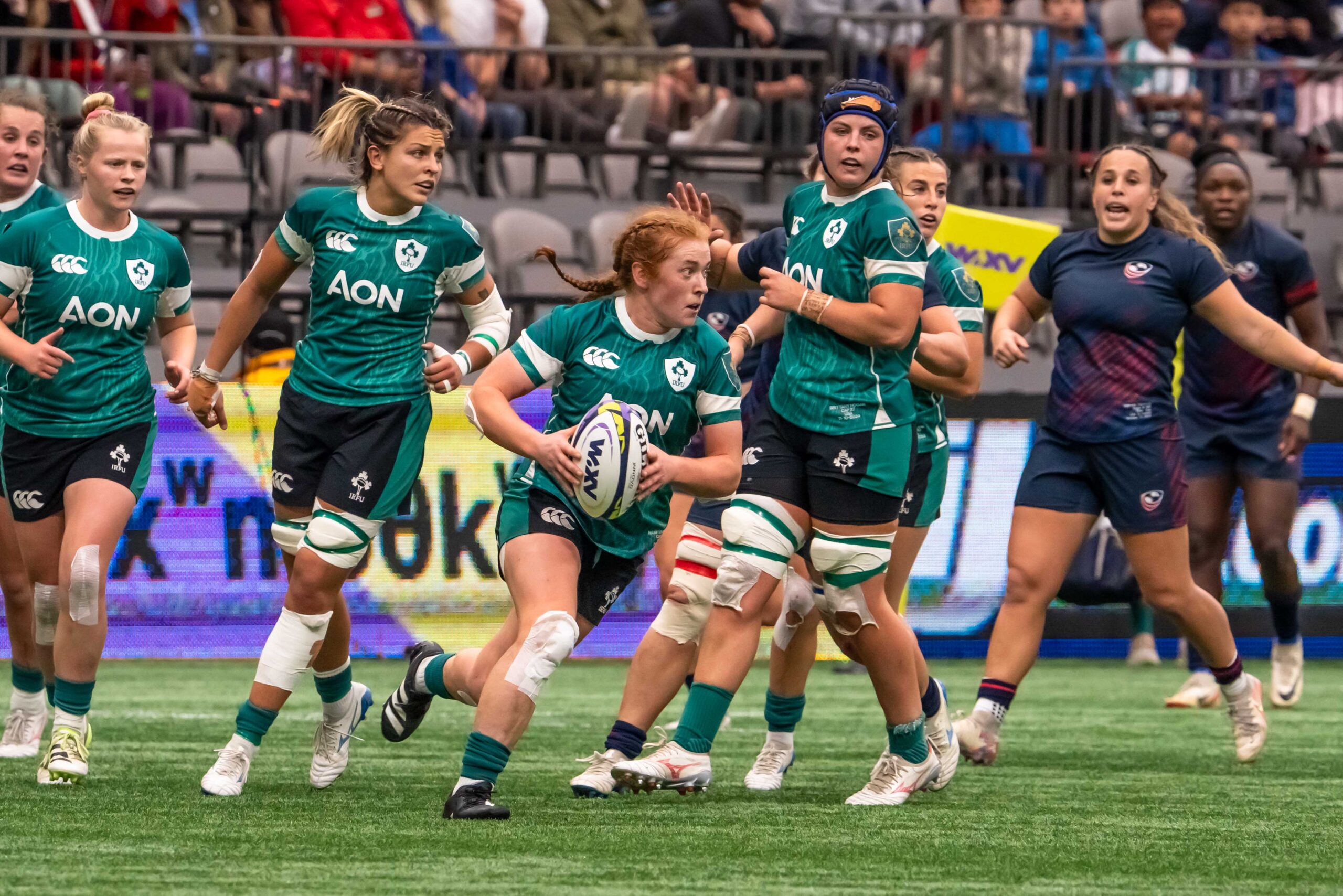 Ireland Women's Rugby scrum-half passing the ball quickly during a match against the USA.