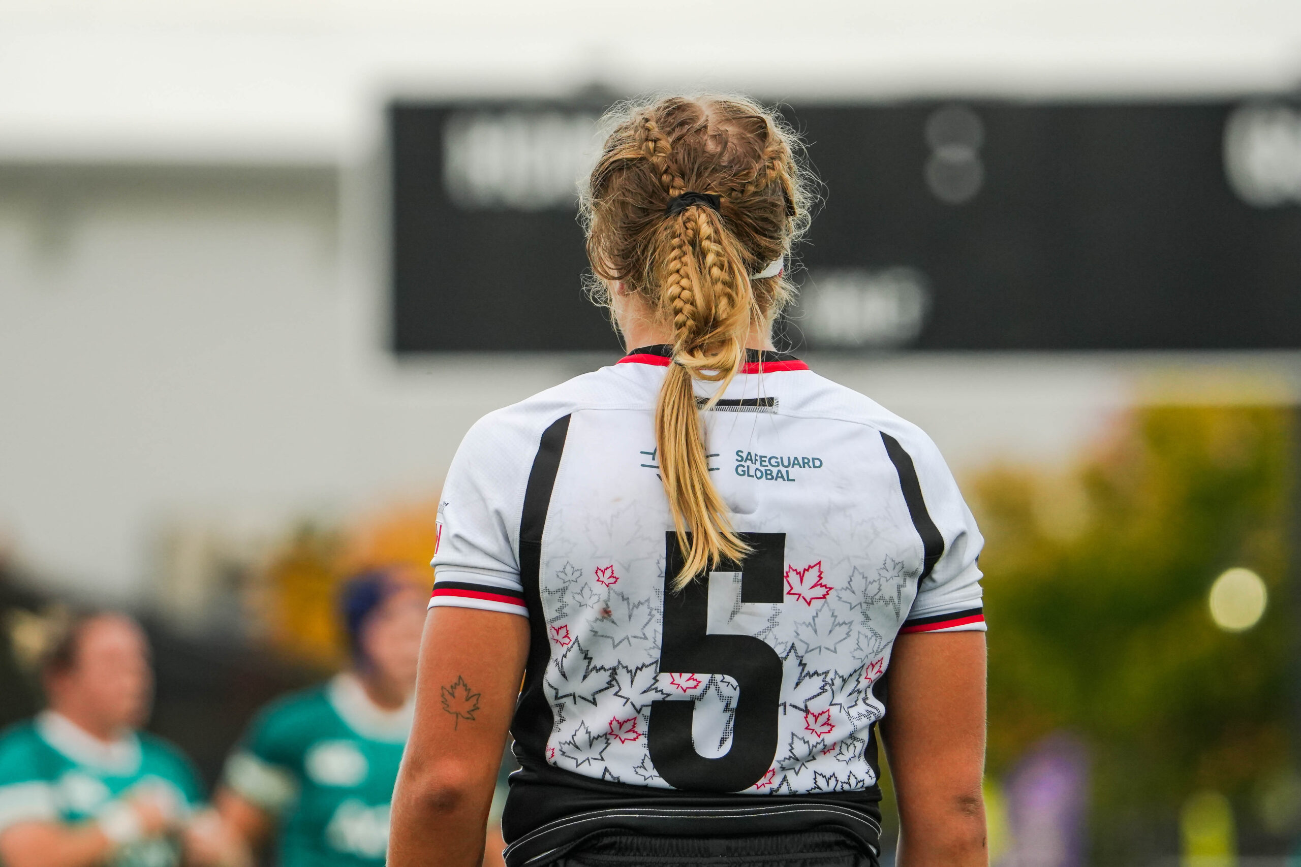 Back view of Canada Women's Rugby player number 5 showing the iconic maple leaf jersey design
