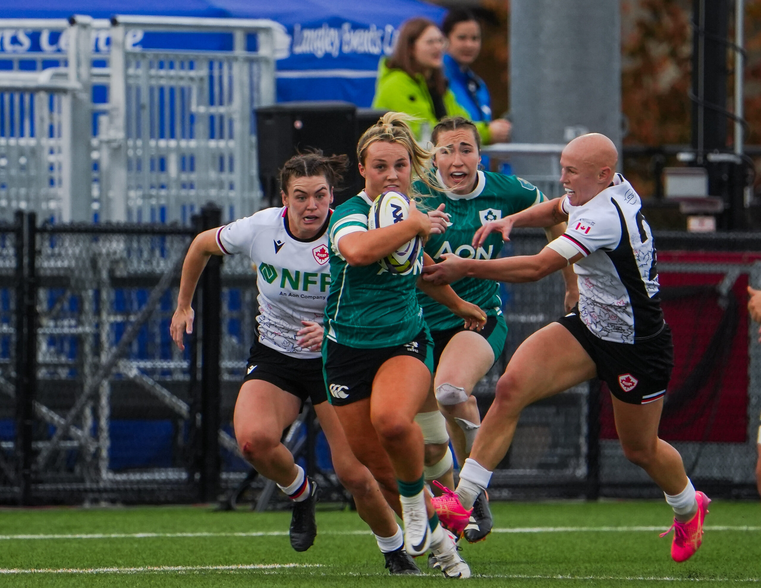 Fast-paced run by a Canada Rugby player during a competitive international match.