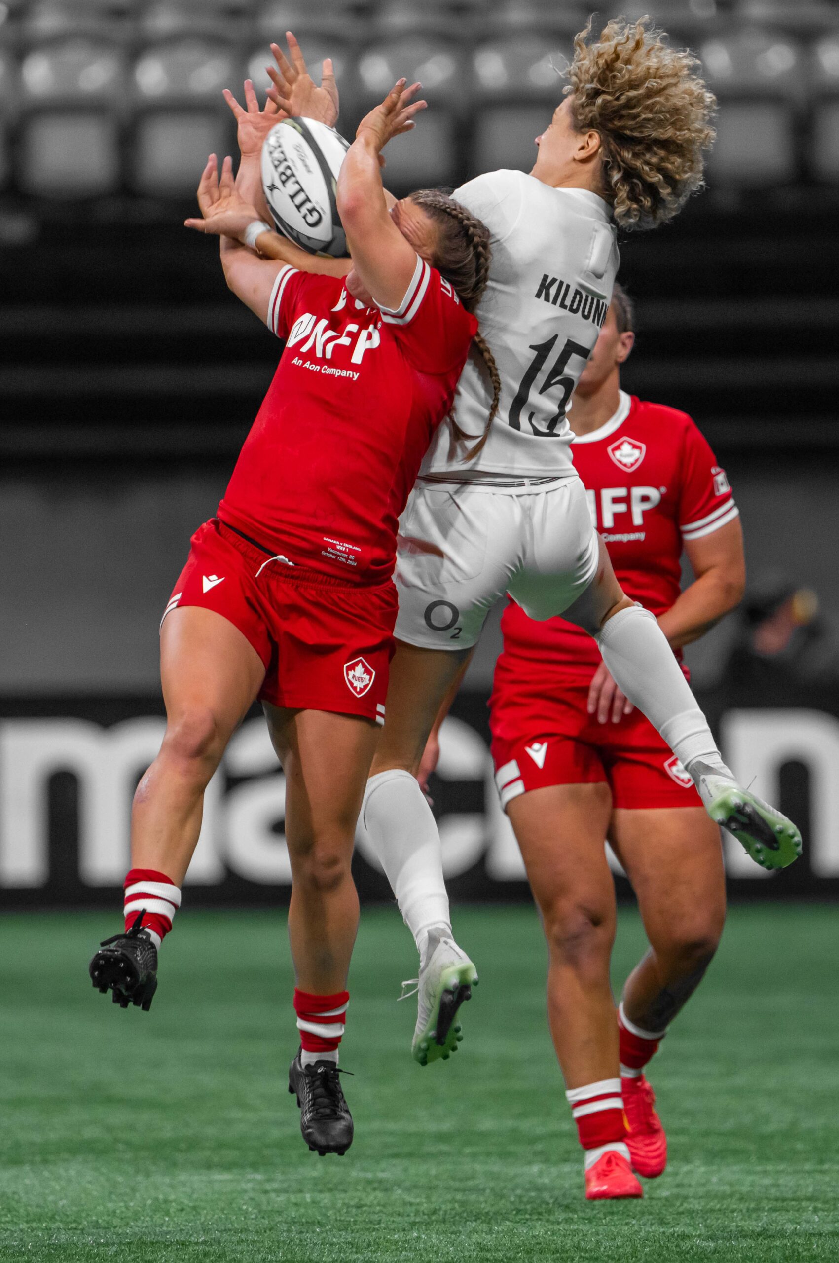 England's Ellie Kildunne (15) in a high-impact aerial tackle against Canada during WXV 1 match.