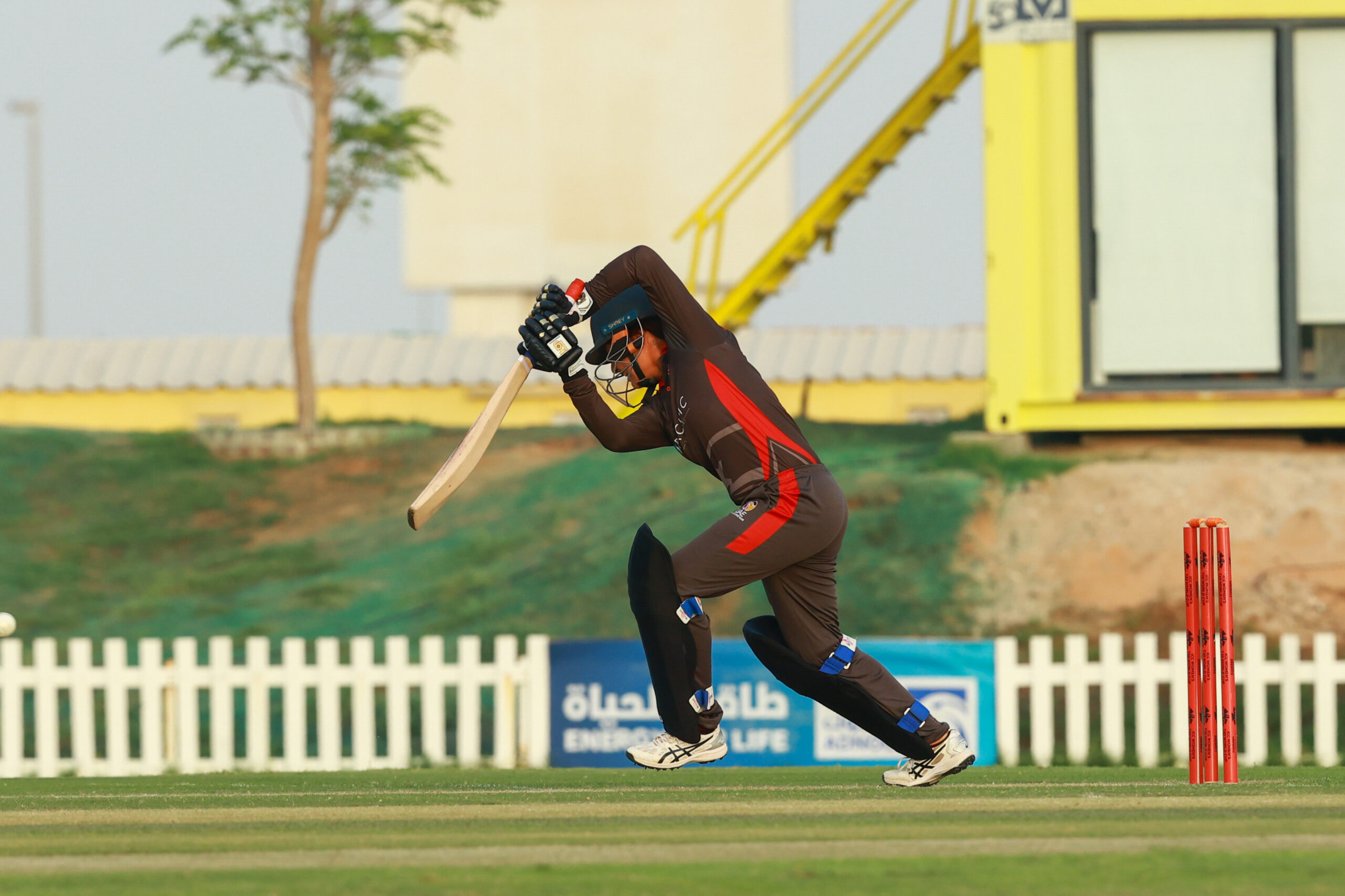 UAE women's cricket team batter playing a shot during an international match at the Abu Dhabi Cricket and Sports Hub