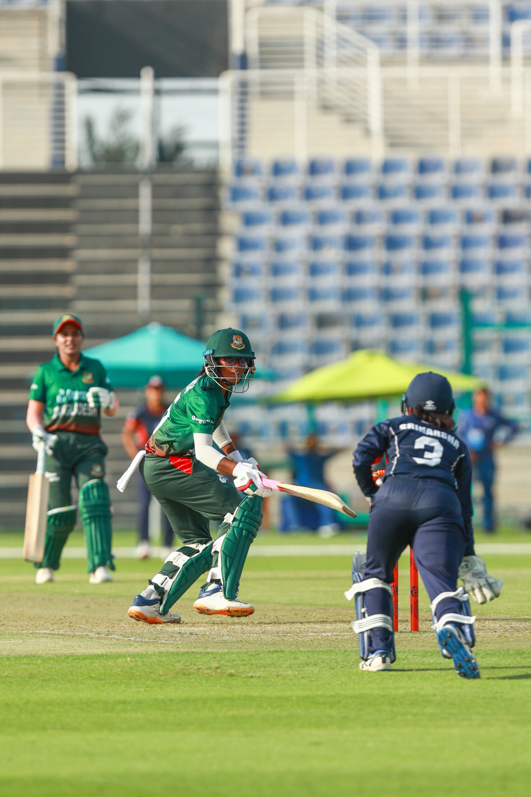 Bangladesh women’s cricket team batter in action at a Dubai stadium; professional women's sports events and international cricket tournaments in the UAE.