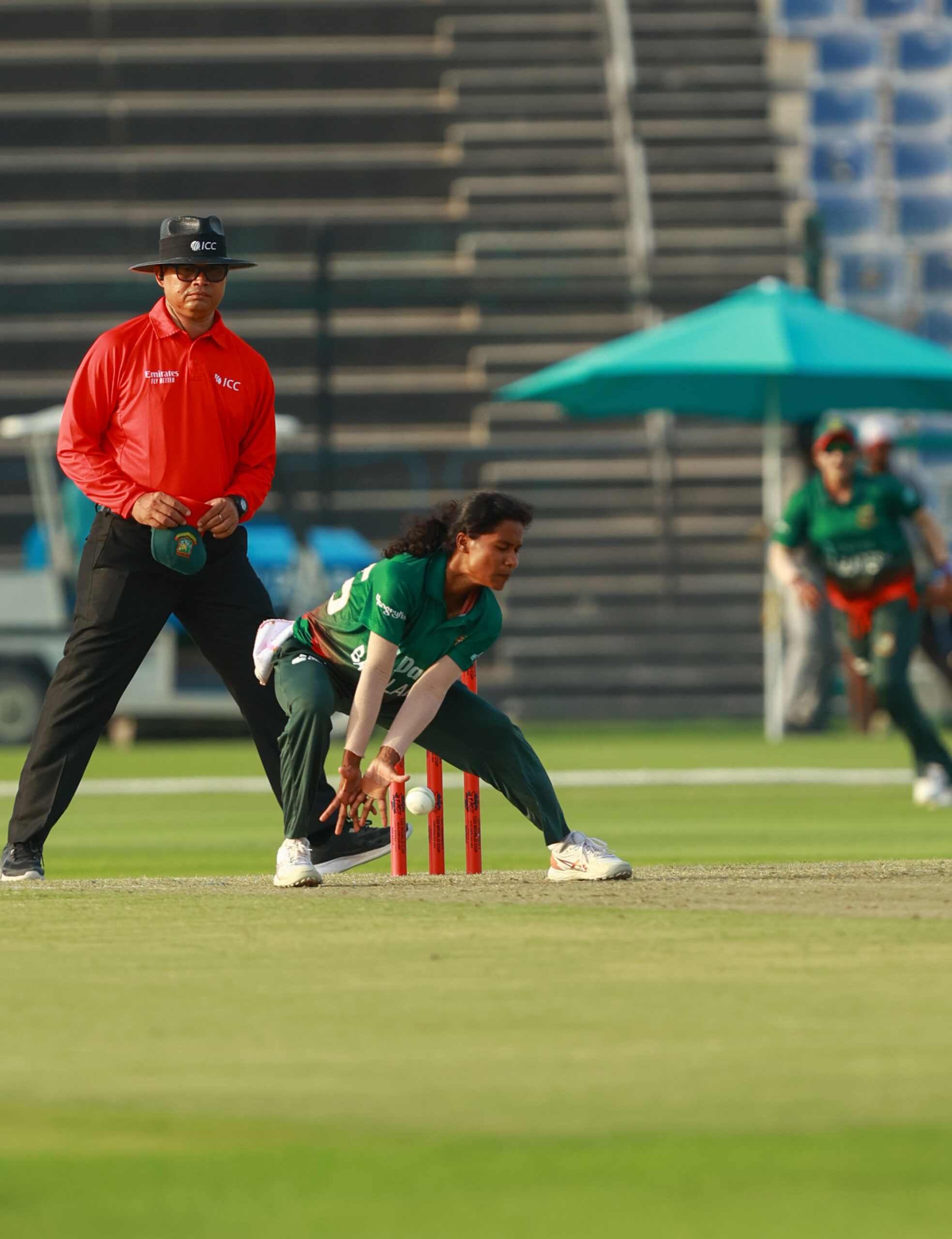 International women's cricket action: Bangladesh fielder attempting a run-out. Professional sports photography from a women’s T20 match, ideal for cricket news and sports highlights in Dubai and Melbourne.